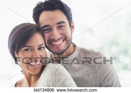 Couple hugging indoors View Large Photo Image Stock Photograph - Couple hugging indoors. Fotosearch