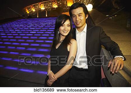Couple outside Oriental Pearl Tower at night, Shanghai, China View Large Photo Image Stock Photo - Couple outside Oriental Pearl Tower at night, Shanghai, China. Fotosearch