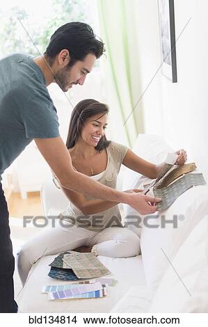 Couple picking out fabric swatches together View Large Photo Image Picture - Couple picking out fabric swatches together. Fotosearch