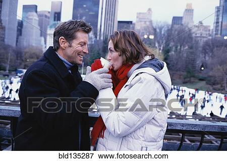 Couple sharing coffee outside Rockefeller Center, New York City, New York, United States View Large Photo Image Stock Photo - Couple sharing coffee outside Rockefeller Center, New York City, New York, United States. Fotosearch
