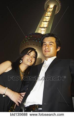 Couple under Oriental Pearl Tower at night, Shanghai, China View Large Photo Image Stock Photo - Couple under Oriental Pearl Tower at night, Shanghai, China. Fotosearch