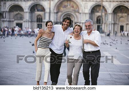 Couples walking together in St. Mark's Square, Venice, Veneto, Italy View Large Photo Image Stock Image - Couples walking together in St. Mark's Square, Venice, Veneto, Italy. Fotosearch