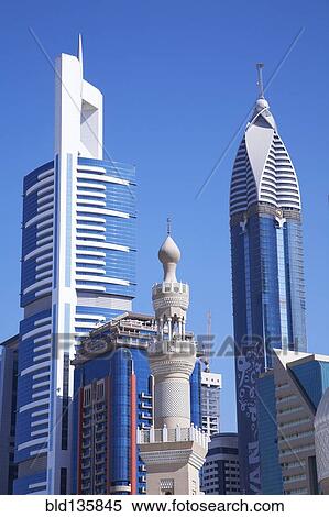 Dubai city skyline against blue sky, Dubai, United Arab Emirates View Large Photo Image Stock Photography - Dubai city skyline against blue sky, Dubai, United Arab Emirates. Fotosearch