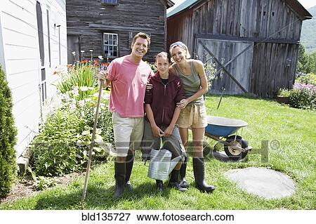 Family gardening together View Large Photo Image Stock Photo - Family gardening together. Fotosearch