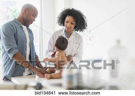Father and baby at doctor's office View Large Photo Image Stock Image - Father and baby at doctor's office. Fotosearch