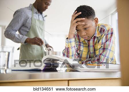 Frustrated boy doing homework View Large Photo Image Stock Image - Frustrated boy doing homework. Fotosearch