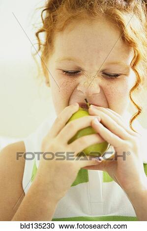 Girl eating apple View Large Photo Image Stock Image - Girl eating apple. Fotosearch