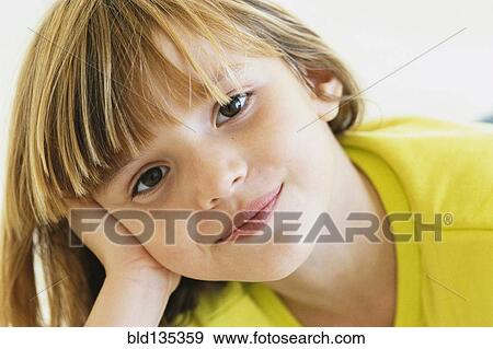 Girl resting head on hand View Large Photo Image Stock Photo - Girl resting head on hand. Fotosearch