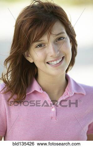 Girl smiling outdoors View Large Photo Image Stock Photograph - Girl smiling outdoors. Fotosearch