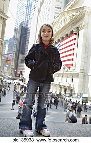 Girl standing outside New York Stock Exchange, New York City, New York, United States View Large Photo Image Stock Photo - Girl standing outside New York Stock Exchange, New York City, New York, United States. Fotosearch