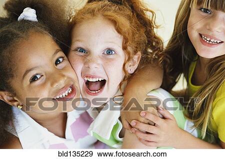 Girls smiling together View Large Photo Image Stock Photo - Girls smiling together. Fotosearch
