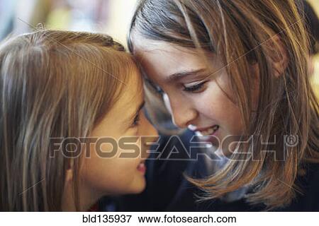 Girls smiling together View Large Photo Image Stock Photo - Girls smiling together. Fotosearch