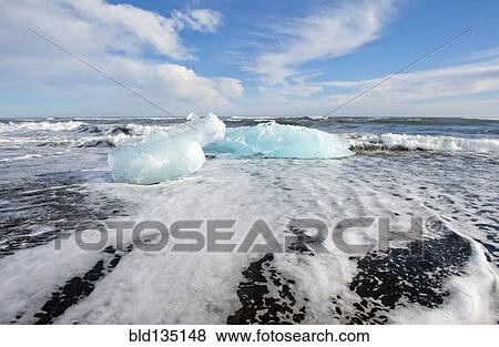 Stock Photo - Glaciers melting on arctic beach. Fotosearch