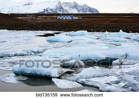 Stock Photo - Glaciers melting on arctic beach. Fotosearch