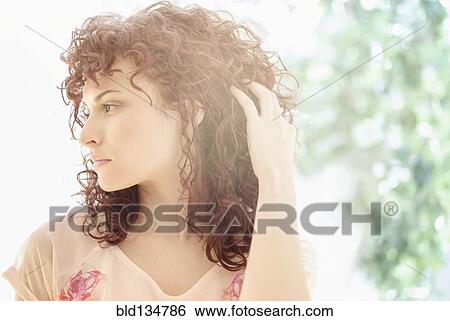 Hispanic woman tossing her hair View Large Photo Image Stock Photograph - Hispanic woman tossing her hair. Fotosearch
