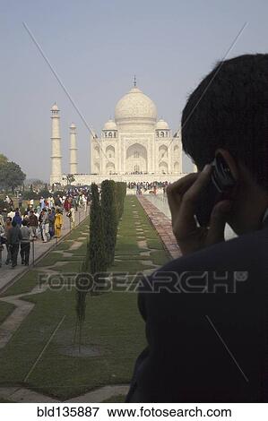 Indian businessman on cell phone by Taj Mahal, Agra, India View Large Photo Image Stock Photo - Indian businessman on cell phone by Taj Mahal, Agra, India. Fotosearch