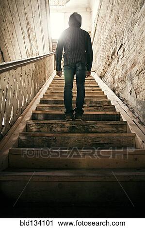 Mari man standing on staircase View Large Photo Image Stock Image - Mari man standing on staircase. Fotosearch