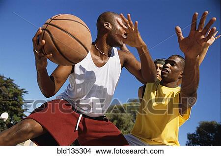 Men playing basketball outdoors View Large Photo Image Picture - Men playing basketball outdoors. Fotosearch
