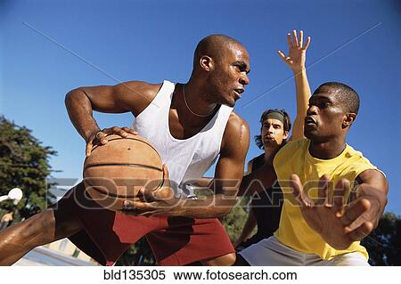 Men playing basketball outdoors View Large Photo Image Stock Photography - Men playing basketball outdoors. Fotosearch