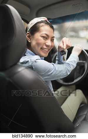 Mixed race teenage girl holding keys to car View Large Photo Image Stock Image - Mixed race teenage girl holding keys to car. Fotosearch
