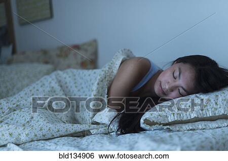 Mixed race teenage girl sleeping in bed View Large Photo Image Stock Photograph - Mixed race teenage girl sleeping in bed. Fotosearch