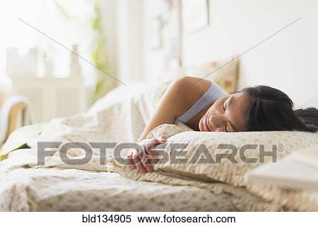 Mixed race teenage girl sleeping in bed View Large Photo Image Stock Photography - Mixed race teenage girl sleeping in bed. Fotosearch