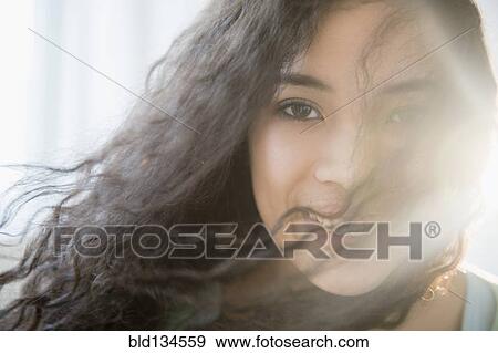 Mixed race teenage girl smiling View Large Photo Image Stock Photo - Mixed race teenage girl smiling. Fotosearch