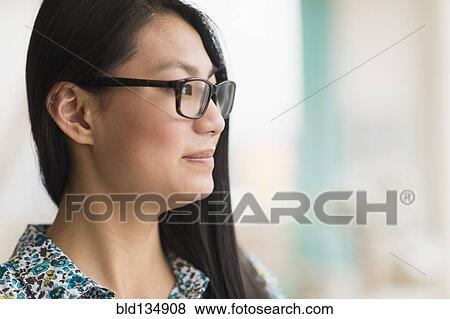 Stock Photo - Mixed race teenage girl smiling. Fotosearch