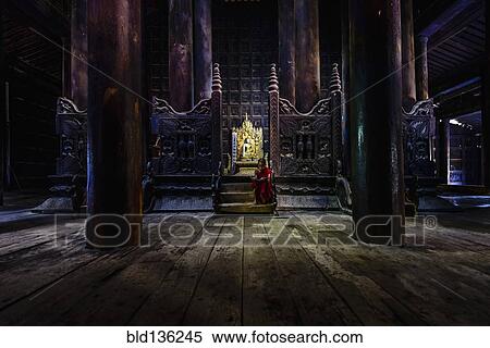 Monk siting by ornate shrine in temple View Large Photo Image Stock Photography - Monk siting by ornate shrine in temple. Fotosearch