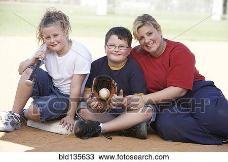 Mother and children smiling outdoors View Large Photo Image Stock Image - Mother and children smiling outdoors. Fotosearch