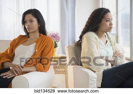 Mother and daughter arguing in living room View Large Photo Image Stock Photo - Mother and daughter arguing in living room. Fotosearch