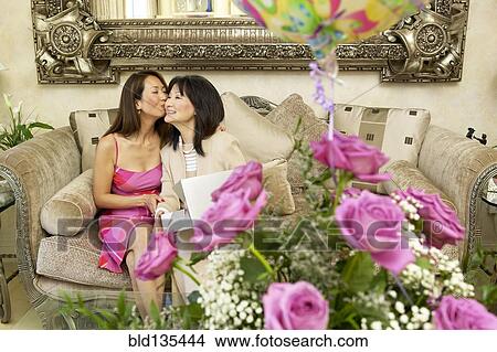 Picture - Mother and daughter celebrating birthday. Fotosearch