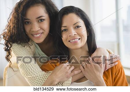 Stock Photo - Mother and daughter hugging. Fotosearch