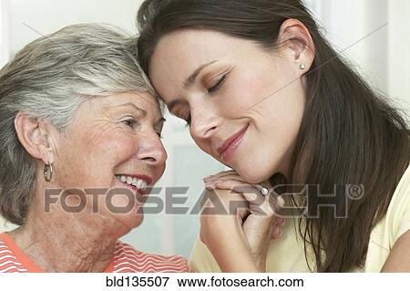 Stock Photo - Mother and daughter hugging. Fotosearch