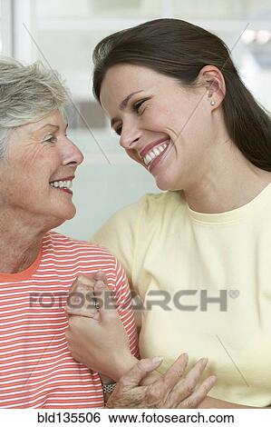 Mother and daughter hugging View Large Photo Image Stock Photograph - Mother and daughter hugging. Fotosearch