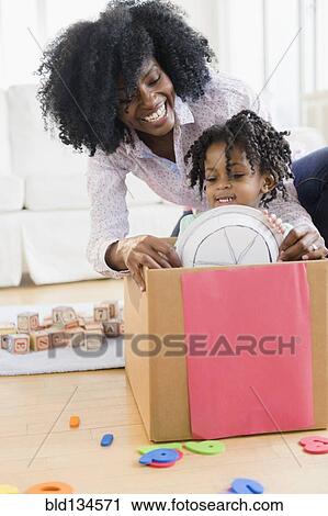 Mother and daughter playing together View Large Photo Image Stock Image - Mother and daughter playing together. Fotosearch