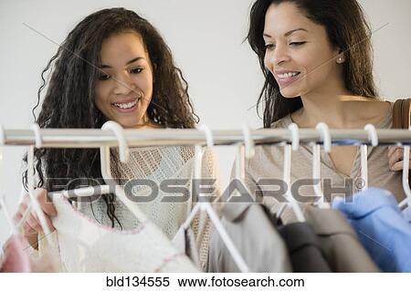 Mother and daughter shopping for clothing View Large Photo Image Stock Photography - Mother and daughter shopping for clothing. Fotosearch