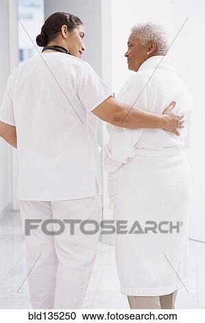 Nurse comforting Senior patient in hospital View Large Photo Image Stock Image - Nurse comforting Senior patient in hospital. Fotosearch