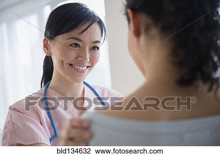 Nurse talking to patient in hospital View Large Photo Image Stock Image - Nurse talking to patient in hospital. Fotosearch