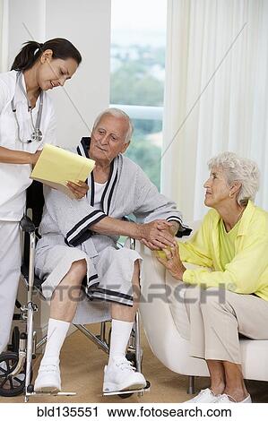 Nurse talking to Senior couple View Large Photo Image Stock Image - Nurse talking to Senior couple. Fotosearch