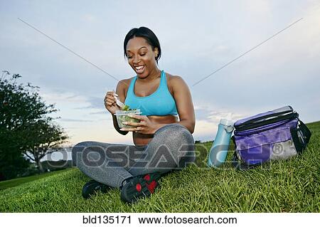 Pregnant woman eating salad in park View Large Photo Image Stock Image - Pregnant woman eating salad in park. Fotosearch