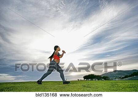 Pregnant woman exercising in park View Large Photo Image Stock Photo - Pregnant woman exercising in park. Fotosearch