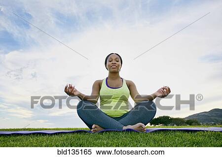 Pregnant woman meditating in park View Large Photo Image Stock Photography - Pregnant woman meditating in park. Fotosearch