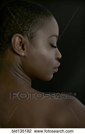 Rear view of black woman with eyes closed View Large Photo Image Stock Image - Rear view of black woman with eyes closed. Fotosearch