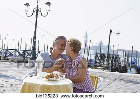 Senior couple eating at sidewalk cafe, Venice, Veneto, Italy View Large Photo Image Stock Image - Senior couple eating at sidewalk cafe, Venice, Veneto, Italy. Fotosearch