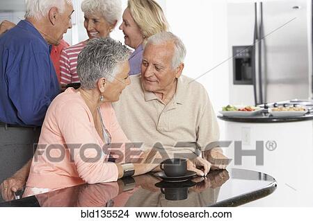 Senior couple having coffee in kitchen View Large Photo Image Picture - Senior couple having coffee in kitchen. Fotosearch