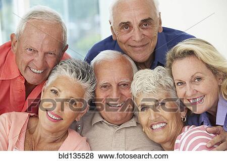 Senior friends smiling together View Large Photo Image Stock Photo - Senior friends smiling together. Fotosearch