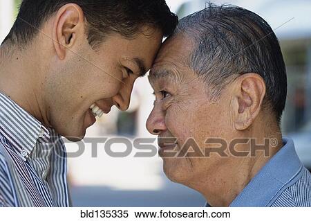Senior man and son smiling outdoors View Large Photo Image Stock Photography - Senior man and son smiling outdoors. Fotosearch