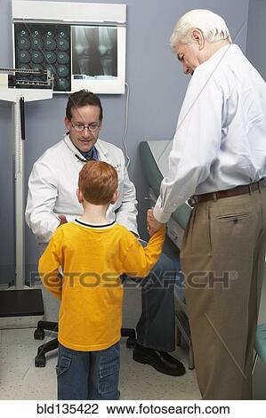 Stock Image - Senior man bringing grandson to doctor's visit. Fotosearch
