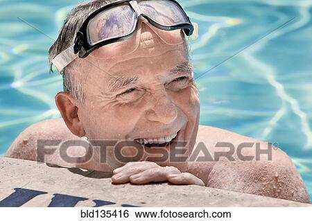 Senior man smiling in swimming pool View Large Photo Image Stock Photograph - Senior man smiling in swimming pool. Fotosearch